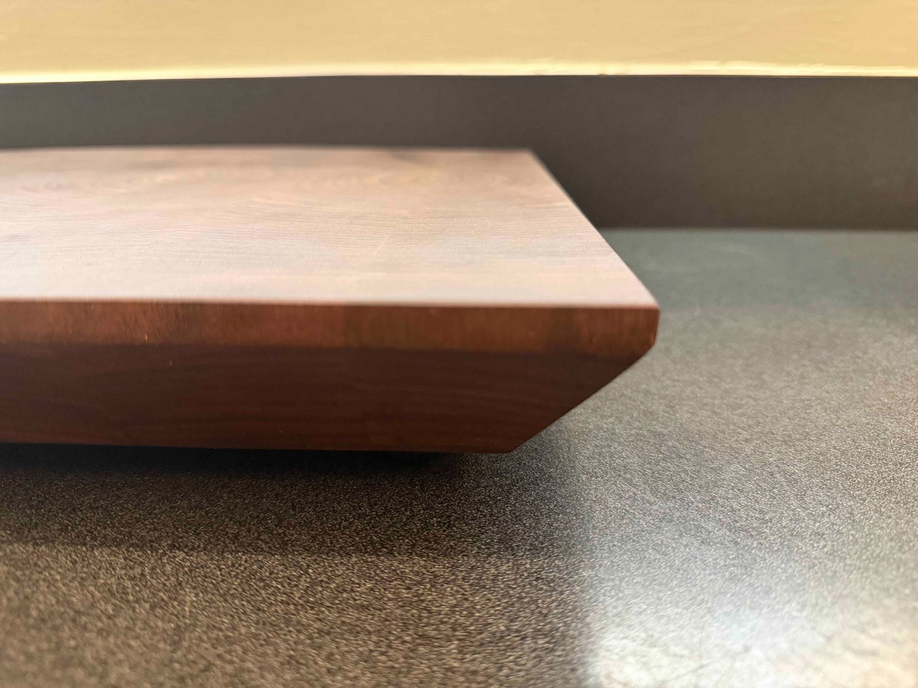 Close-up of the eased edge on a walnut end-grain board
